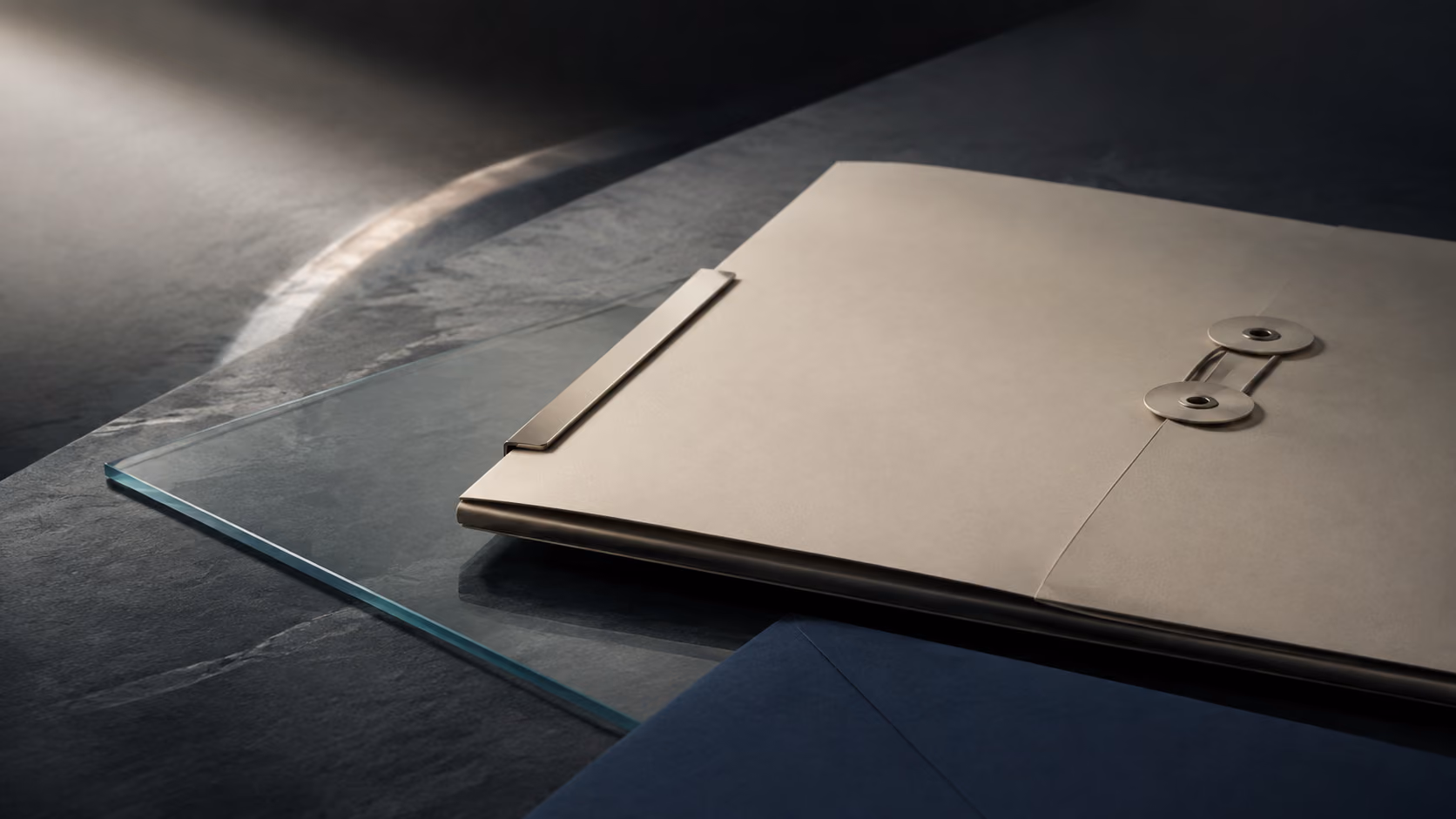 Archival folio and glass plane arranged as a visual study of careful record stewardship